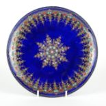 A 19TH CENTURY FRENCH LIMOGES ENAMELLED COPPER DISH Decorated with a central star-form motif