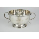 A CHESTER SILVER TWIN HANDLED BOWL Plain circular form with twin scrolled handles, hallmarked George