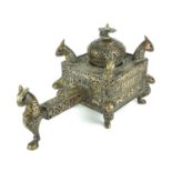 A 18TH/19TH CENTURY PERSIAN BRASS AND SILVER INLAID FIGURAL INCENSE BURNER In the form of mythical