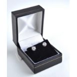 AN 18CT WHITE GOLD DIAMOND STUD EARRINGS Each set with a single round cut diamond. (approx total