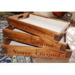 A GRADUATED SET OF THREE STAINED WOOD AND METAL BOUND VINEYARD PAINTED AND DECORATED TRAYS. (largest