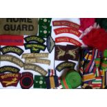 A COLLECTION OF EARLY 20TH CENTURY BRITISH ARMY FABRIC INSIGNIA Including Home Guard, Borders, Kings