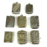 A COLLECTION OF EIGHT EARLY 20TH CENTURY SILVER PLATED VESTA CASES With embossed decoration. (approx