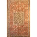 AN IRANIAN RUG The central madder field surrounded by botch symbols contained within three running