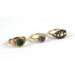 A VINTAGE 18CT GOLD, AMETHYST AND DIAMOND RING The round cut amethyst edged with diamonds,