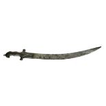 A 19TH CENTURY MIDDLE EASTERN SWORD With iron grip and engraved curved blade.