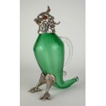 A WHITE METAL AND GREEN GLASS NOVELTY 'PARROT' CLARET JUG The hinged head set with glass eyes and