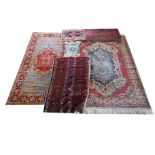 A MIDDLE EASTERN PRAYER RUG Along with seven other matts and rugs various designs. (largest 111cm