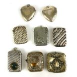 A COLLECTION OF EIGHT EARLY 20TH CENTURY SILVER PLATED RECTANGULAR VESTA CASES Embossed