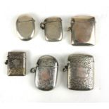 A COLLECTION OF SIX EARLY 20TH CENTURY SILVER VESTA CASES Including an oval form case, hallmarked