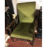 AN EARLY 20TH CENTURY BEECHWOOD RECLINING CHAIR With a green velvet upholstered seat and back. (64cm