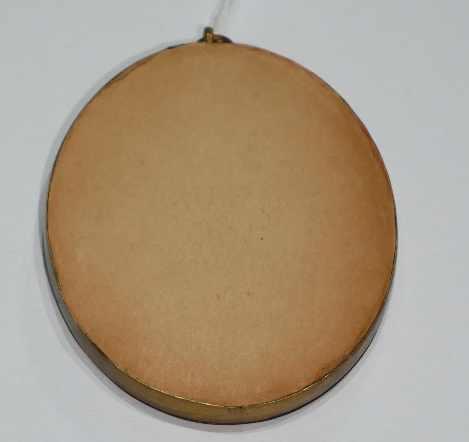 A 19TH CENTURY OVAL MINIATURE PORTRAIT OF A LADY Gilt framed. (8cm) - Image 2 of 2