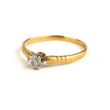 AN EARLY 20TH CENTURY 18CT GOLD AND DIAMOND SOLITAIRE RING The single round cut diamond on an Art