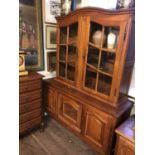AN EARLY/MID 20TH CENTURY DUTCH OAK BOOKCASE/DISPLAY CABINET With two glazed doors above
