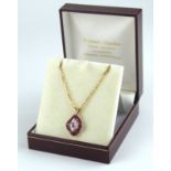 A VINTAGE 9CT GOLD, RUBY AND DIAMOND PENDANT NECKLACE The single marquis cut ruby edged with