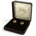 A VINTAGE PAIR OF 9CT GOLD KNOTT EARRINGS Circular form with stud backs and fitted velvet lined box.