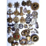 A COLLECTION OF THIRTY-FIVE EARLY 20TH CENTURY BRITISH ARMY CAP BADGES Including Durham, Yorkshire