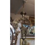 AN ART NOVEAU PERIOD BRASS FIVE BRANCH CHANDELIER With pierced organic decoration.