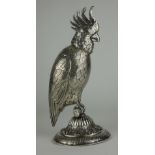 A GERMAN SILVER MODEL OF A PARROT Having a raised plume, fine engraved decoration and circular base,