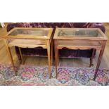 A PAIR OF EDWARDIAN MAHOGANY AND GLAZED BIJOUTERIE TABLES With hinged rectangular top, on square