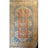 A TURKISH WOOLLEN MILAS RUG Five central lozenges contained within the stylised organic borders in