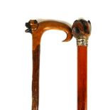 TWO LATE VICTORIAN/EDWARDIAN WALKING CANES Both with carved handles in the form of pug dogs, one