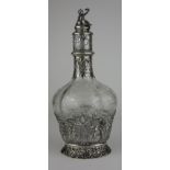 A LATE 19TH/EARLY 20TH CENTURY DUTCH SILVER AND ETCHED GLASS DECANTER Having a figural finial,
