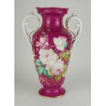 A 19TH CENTURY FRENCH PARIS PORCELAIN VASE Twin handles with hand painted floral decoration on