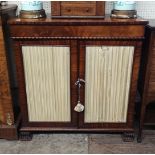 A 19TH CENTURY MAHOGANY SIDE CABINET With two silk lined doors enclosing shelves, on stylised paw