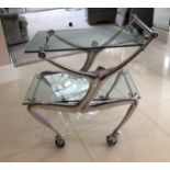 CARROL BOYES, A STYLISH CAST ALUMINIUM DRINK'S TROLLEY With two plate glass shelves. (75cm x 50cm