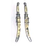A PAIR OF ORIENTAL MINIATURE SWORDS In white metal and ivory scabbards with etched decoration. (