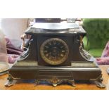 A 19TH CENTURY VICTORIAN MANTEL CLOCK On black slate, richly decorated with idealised vegetal motifs