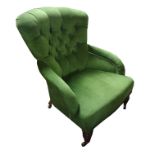HOWARD & SONS, VICTORIAN BUTTON BACK UPHOLSTERED OPEN ARMCHAIR Raised on turned wlanut legs
