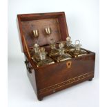 A GEORGIAN MAHOGANY AND BRASS SEA CAPTAINS DECANTER RECTANGULAR CHEST With twin brass handles, the