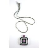 AN 18CT WHITE GOLD, DIAMOND RUBY AND SAPPHIRE PENDANT NECKLACE The central round cut ruby in a