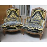 A PAIR OF CONTINENTAL CARVED BEECHWOOD FRAMED ARMCHAIRS UPHOLSTERED IN A VERSACE VELVET. (75cm x