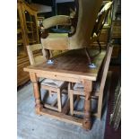 A VICTORIAN STYLE PINE FARMHOUSE TABLE Along with six ladder back chairs. (183cm x 92cm x 78cm)