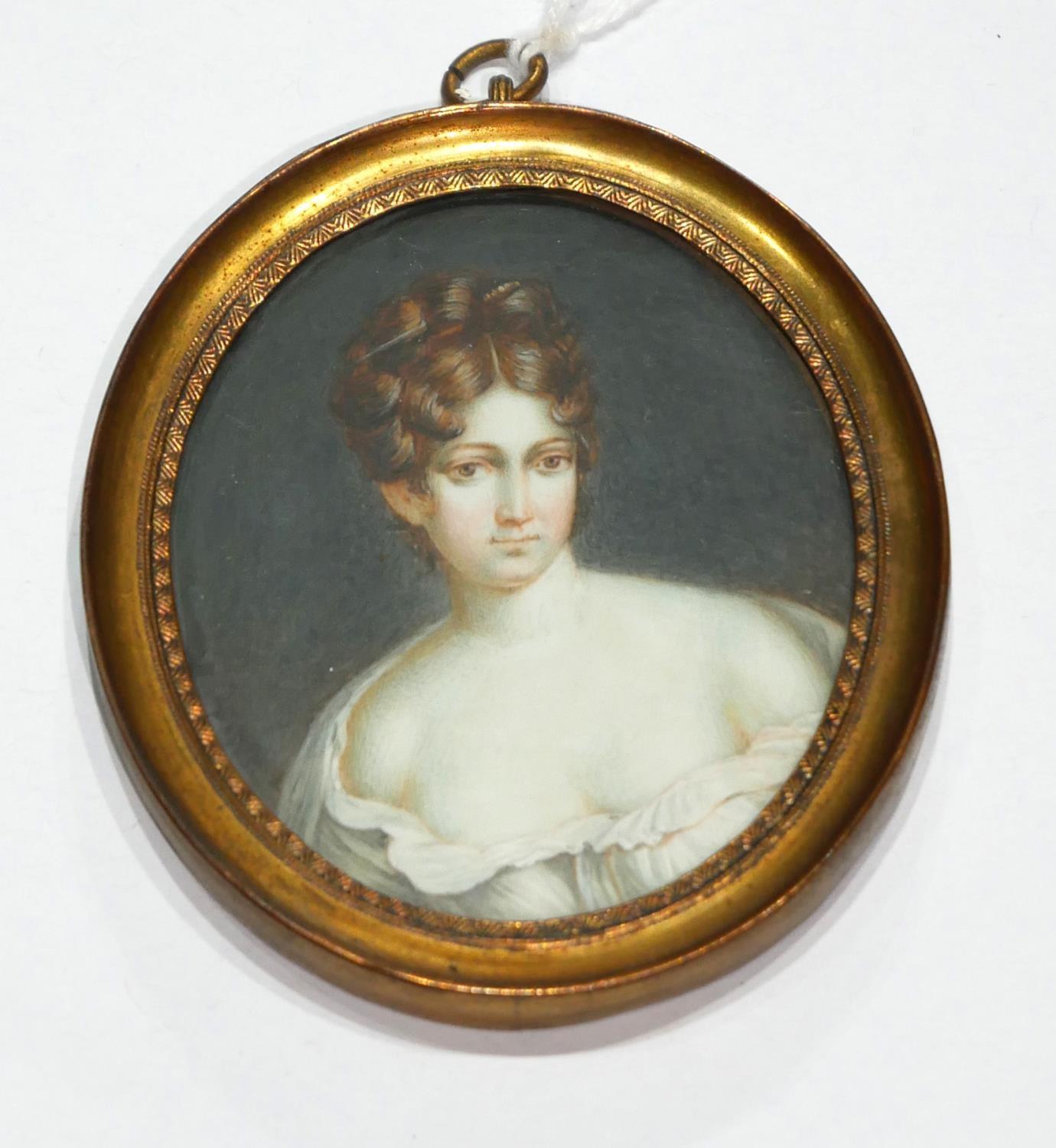 A 19TH CENTURY OVAL MINIATURE PORTRAIT OF A LADY Gilt framed. (8cm)