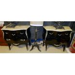 A PAIR OF FRENCH MARBLE TOPPED AND EBONISED BOMBE COMMODES With three short drawers above one long