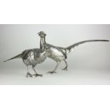 A PAIR OF CONTINENTAL SILVER PHEASANTS Male and female birds with fine detailed engraved decoration,
