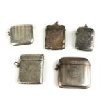 A COLLECTION OF FIVE EARLY 20TH CENTURY SILVER VESTA CASES Including a rectangular form with