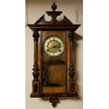 AN EARLY 20TH CENTURY AUSTRIAN WALNUT WALL CLOCK Having a carved pediment with applied lion mask and
