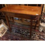 A REGENCY MAHOGANY AND LINE INLAID FOLD OVER CARD TABLE Raised on square tapering legs. (99cm x 45cm