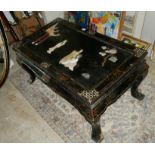 A CHINESE BLACK LACQUERED COFFEE TABLE Decorated with soapstone relief figures of maidens in a