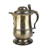 A LARGE GEORGIAN SILVER LIDDED TANKARD Having a scrolled handle with pierced finial and later