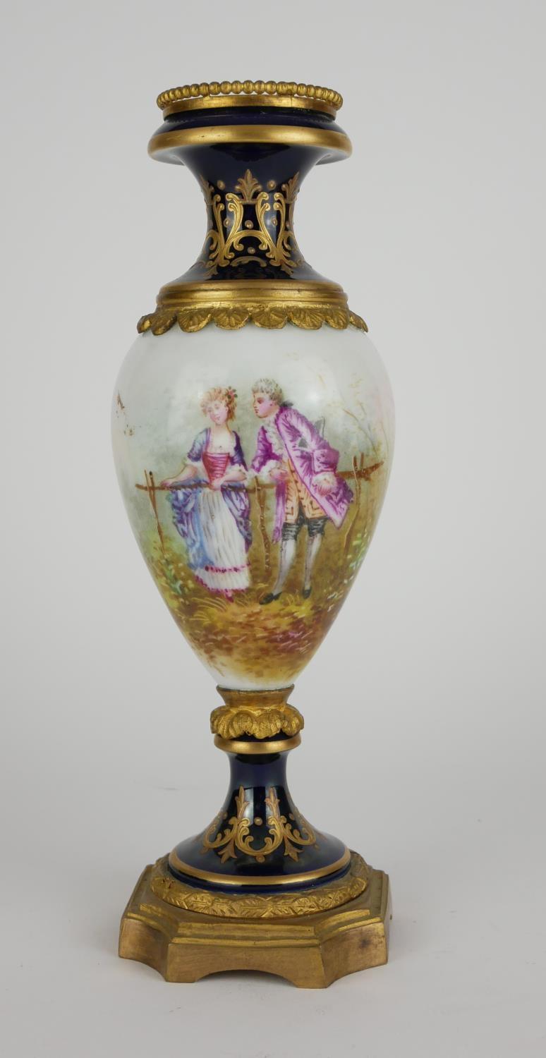 A 19TH CENTURY FRENCH SÈVRES PORCELAIN AND ORMOLU VASE Hand painted figural decoration of a courting