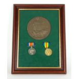 A FRAMED WWI SET OF BRITISH ARMY WAR MEDALS Comprising a bronze Brittania Memorial plaque, a