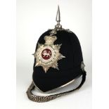 A 20TH CENTURY OFFICER'S SPIKED BLUE CLOTH HELMET OF THE KINGS OWN REGIMENT With white metal