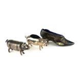 A COLLECTION OF SILVER NOVELTY TRINKET ITEMS Comprising two pin cushions, a shoe and pig, together
