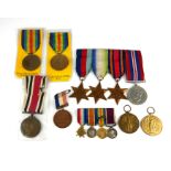 A GROUP OF FOUR WWI MINIATURE BRITISH WAR MEDALS Including a Long Service and Good Conduct